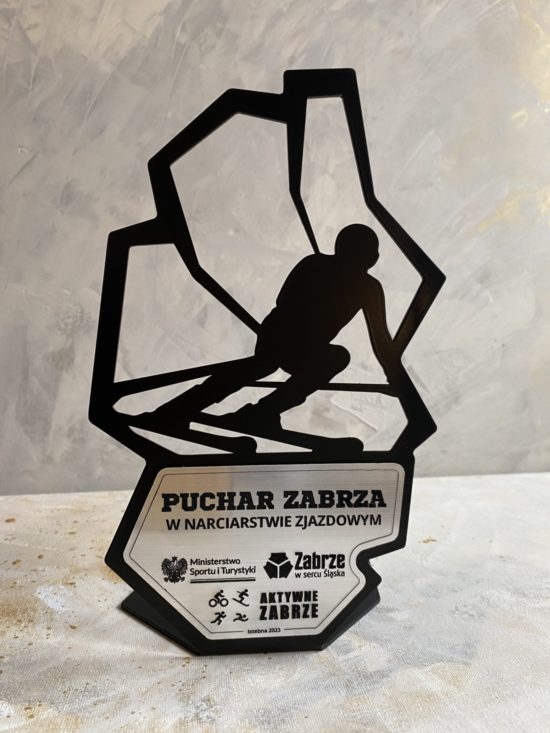 Metalowa statuetka narciarska wraz z personalizowaną tabliczką - granice miasta Zabrze i narciarz.